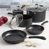 Symphony Premium Forged Non-Stick Cookware Set on counter top next to food