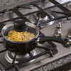 Artistry Non-Stick Cookware Set on cooktop with food cooking