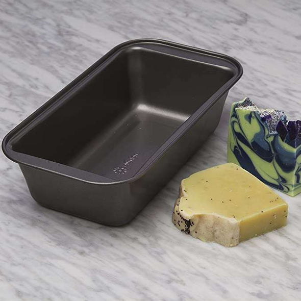 BakeIns Large Non-Stick Loaf Pan on countertop next to soap
