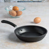 Symphony Forged Non-Stick Fry Pan on counter next to eggs